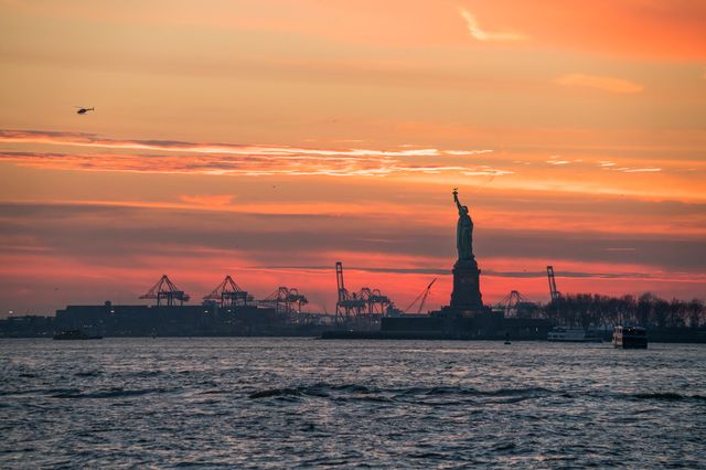 the statue of liberty at sunset